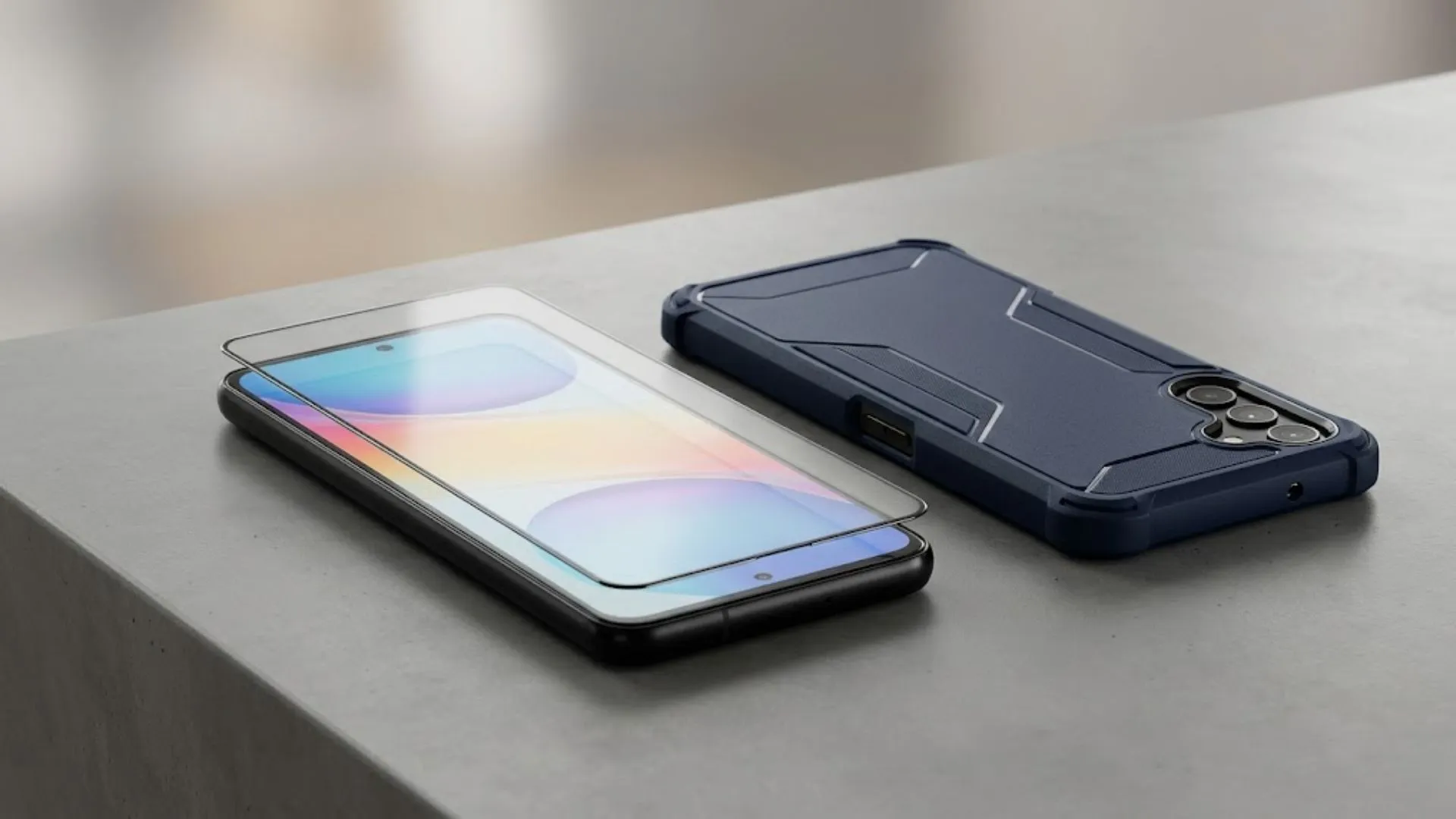 Android smartphone with tempered glass screen protector and rugged protective case placed on table, highlighting device safety and phone repair shop prevention concept