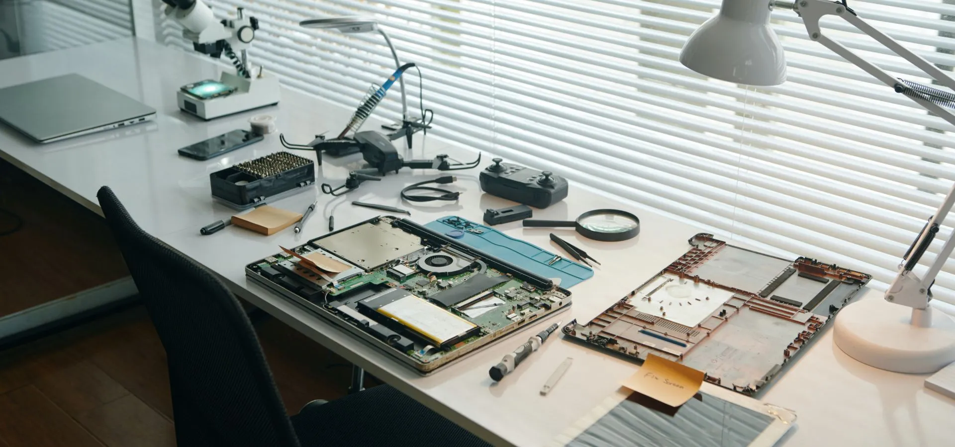 experienced laptop service center technician diagnosing laptop problems and performing detailed hardware and software repairs to ensure smooth and efficient device performance