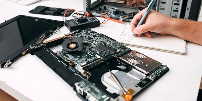 man-performing-laptop-repair